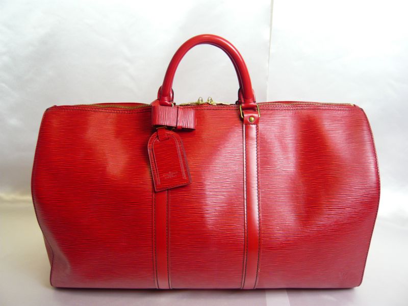 Keepall leather travel bag Louis Vuitton Red in Leather - 27289432
