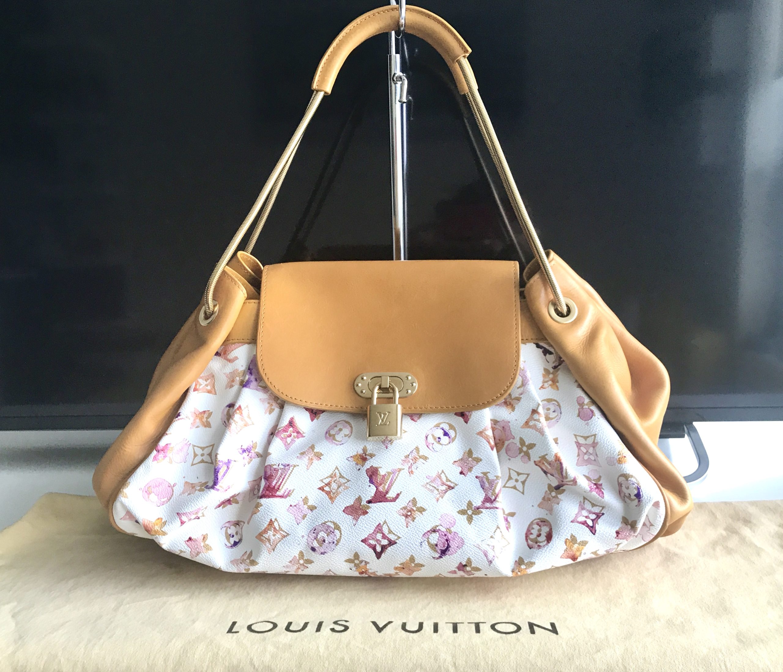 LOT:334  LOUIS VUITTON - a limited edition Richard Prince Jamais handbag.