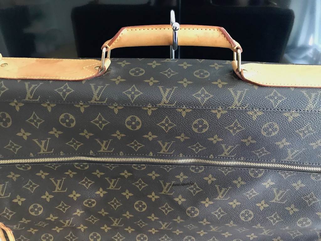 LOUIS VUITTON VINTAGE GARMENT BAG, monogrammed with top handle,  manufactured by The French Co, USA, under special licence, main pocket  inside plus externalo side pockets, hanging hook, 54cm x 20cm closed x